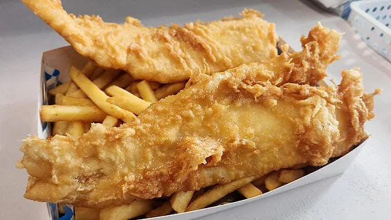 Large battered butterfish on chips