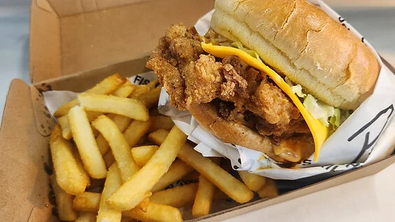 Crispy chicken fillet burger with chips